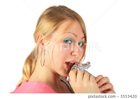 Young girl eats chocolate Young girl eats chocolate 3553420
