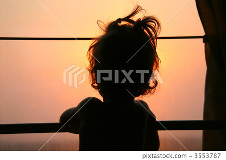 Silhouette of child in window of train 3553787