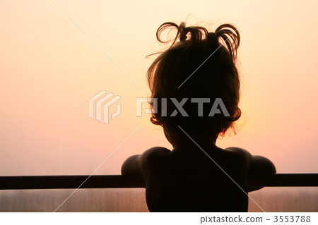 Silhouette of child in window of train 3553788