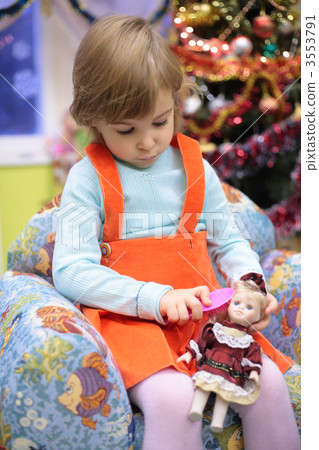 girl in kindergarten with doll 3553791