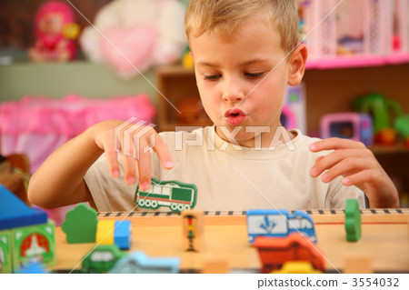 Boy plays  in playroom 3554032