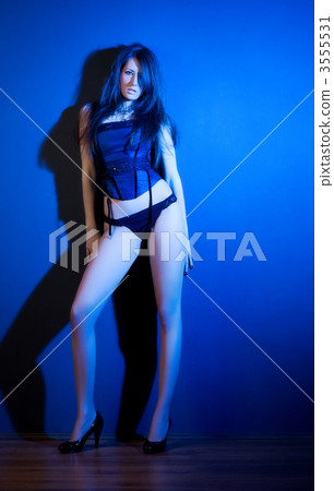 Young sexy woman on wall background Young sexy woman on wall background 3555531