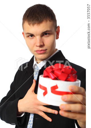 young businessman gives box with gift young businessman gives box with gift 3557057