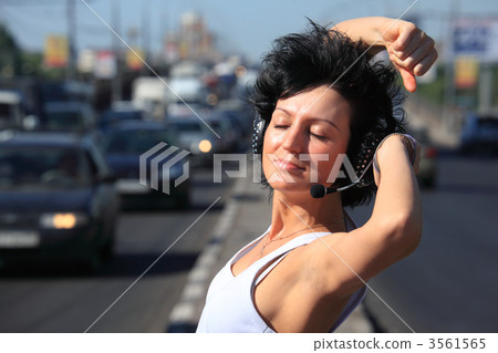 girl in headphone set on highway middle girl in headphone set on highway middle 3561565