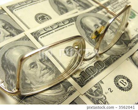 close-up of dollars and eyeglasses close-up of dollars and eyeglasses 3562041