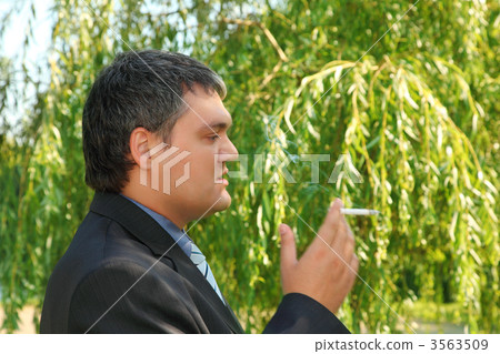 smoking businessman outdoor in summer 3563509