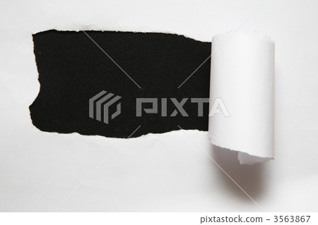 the sheet of torn paper against the black background 3563867