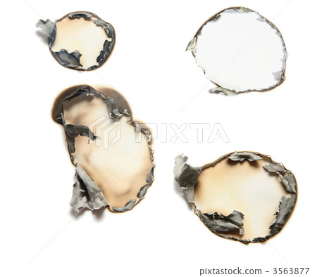 the sheet of paper with the burnt holes against the white background 3563877