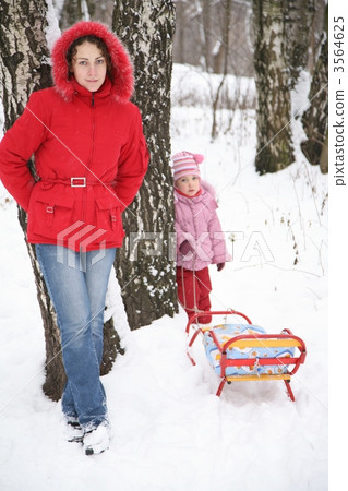 mother and child stand in park at winter 3564625