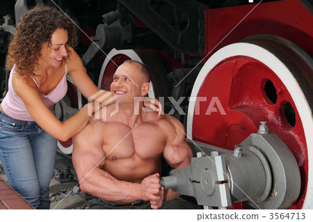 athlete, young woman and locomotive`s wheel athlete, young woman and locomotive`s wheel 3564713
