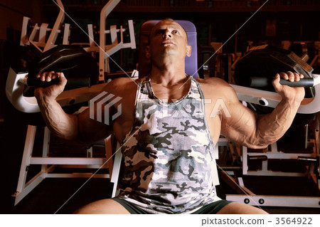 bodybuilder doing weightlifting in gym bodybuilder doing weightlifting in gym 3564922