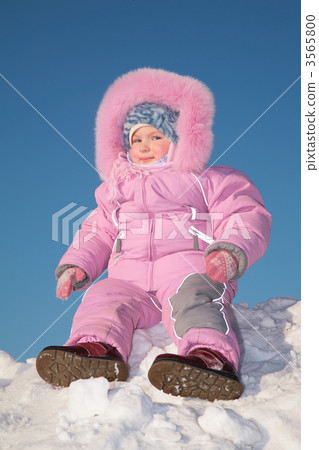 child sit on snow hill 3565800