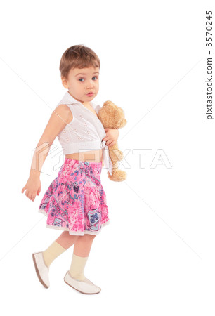 Little girl in skirt with toy 3570245