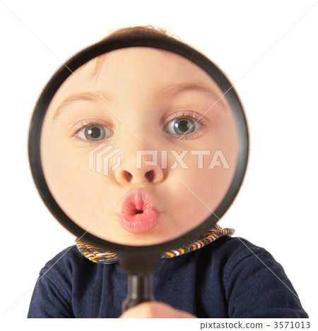 Child kiss through magnifier 3571013