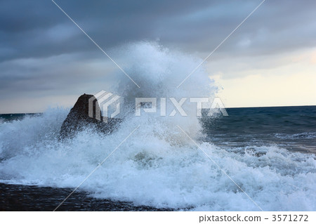 Sea coast with waves breaking about stone Sea coast with waves breaking about stone 3571272