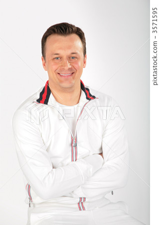 man in white sports suit with crossed hands man in white sports suit with crossed hands 3571595