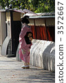 young geisha, back view, japanese umbrella 3572667