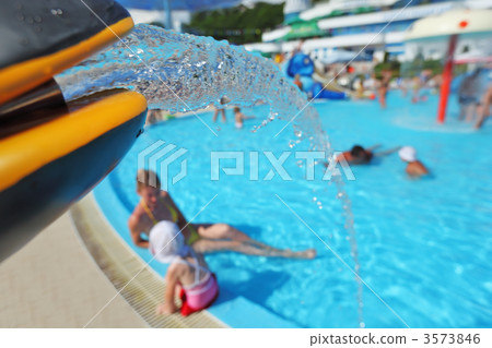 Fountain in form of toy dolphin near pool in aquapark 3573846