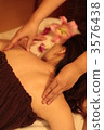 woman getting a massage woman getting a massage 3576438