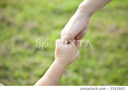 Parent and child join hands 3581663