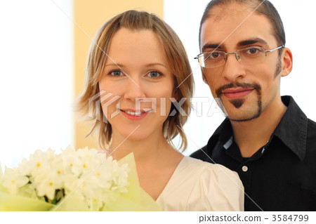 portrait of man in glasses and beauty blond girl with flowers bo portrait of man in glasses and beauty blond girl with flowers bo 3584799