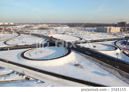 winter cityscape with big interchange, lighting columns and gara winter cityscape with big interchange, lighting columns and gara 3585155