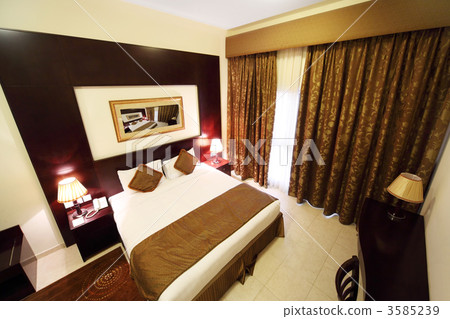 bedroom with white walls, brown curtain and big double bed view 3585239