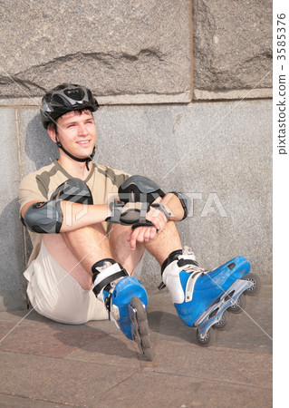 Roller sits under stone wall 3585376