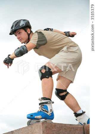 Boy on rollerblades in starting position 3585379