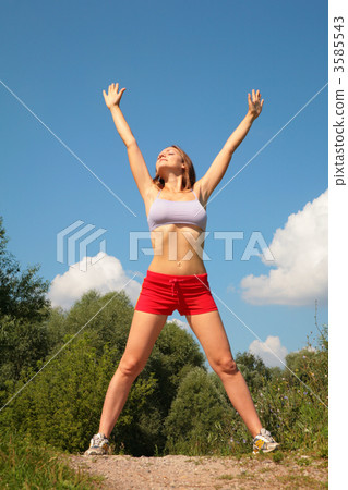 Young woman doing exercise in park 3585543