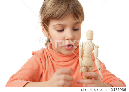 pretty little girl is played by wooden little manikin isolated o 3585986