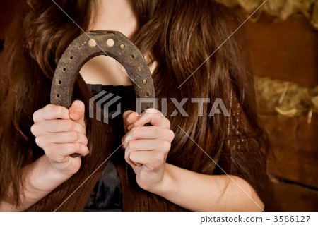 Horseshoe in female hands 3586127