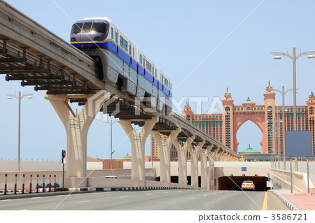 DUBAI - APRIL 19: Atlantis hotel and monorail train on a man-mad DUBAI - APRIL 19: Atlantis hotel and monorail train on a man-mad 3586721