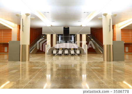 big modern hall with granite floor, columns and two escalators i 3586778