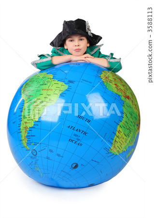 boy in historical dress leans on inflatable globe chin on hands boy in historical dress leans on inflatable globe chin on hands 3588113