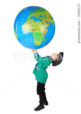 little boy in historical dress holding big inflatable globe over little boy in historical dress holding big inflatable globe over 3588127