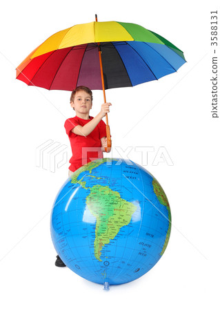 boy in red shirt with multicolored umbrella and inflatable globe 3588131