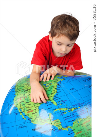 boy in red shirt leans on inflatable globe isolated on white bac boy in red shirt leans on inflatable globe isolated on white bac 3588136