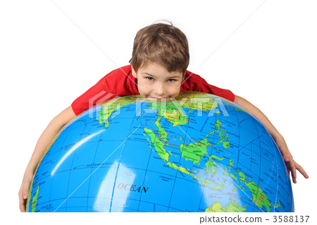 boy in red shirt lies on inflatable globe isolated on white back boy in red shirt lies on inflatable globe isolated on white back 3588137