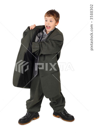 little boy in big grey man's suit and boots hand in pocket isola 3588302