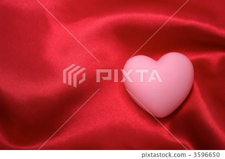 A heart wrapped in red fabric A heart wrapped in red fabric 3596650