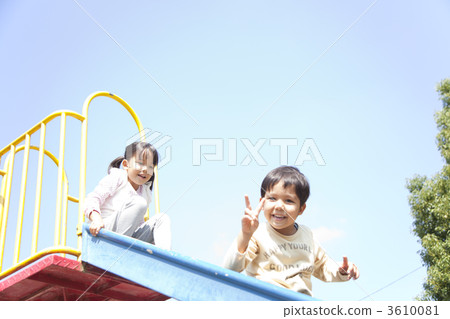 Children playing on the slide 3610081