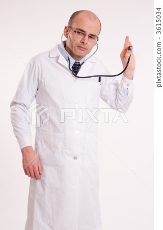 Man in lab coat listening through a stethoscope 3615034