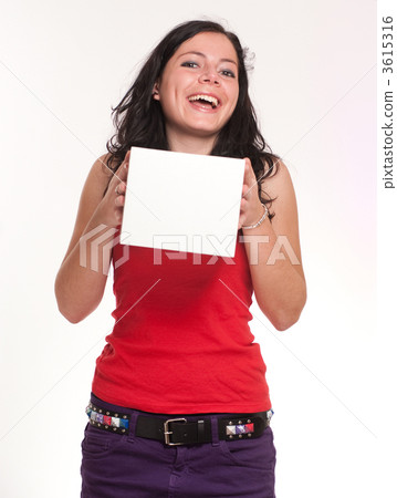 Laughing brunette holding a white box 3615316