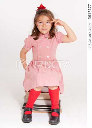 Bespectacled little girl with a thoughtful expression Bespectacled little girl with a thoughtful expression 3617177