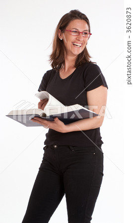 Laughing woman standing with book 3620873