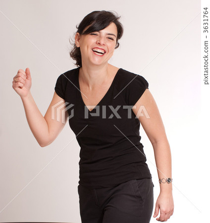 Brunette laughing at a funny joke 3631764