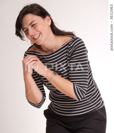 woman with a stripped t-shirt in a fit of laughter 3632063