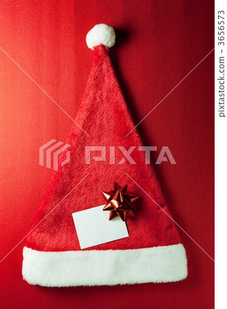 Santa Claus hat and red ribbon and message card 3656573