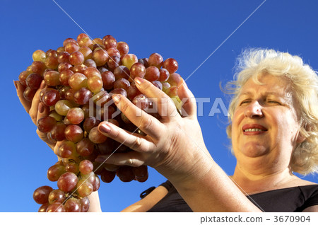 mature woman and grapes 3670904